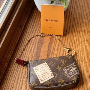 Authentic  Limited edition mini pochette accessory